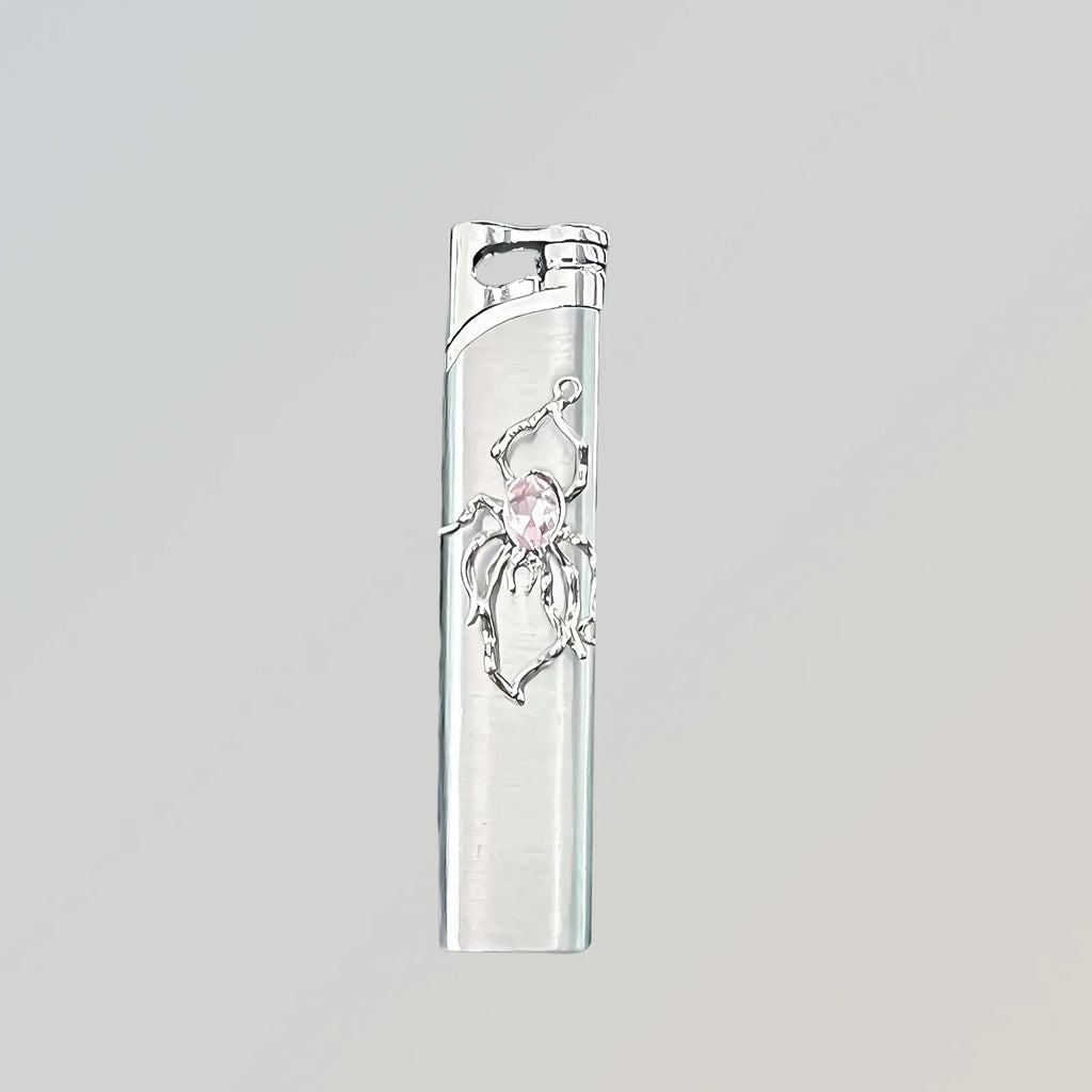 The Rose Arachnid Lighter: metal lighter featuring rose Arachnid Lighter.