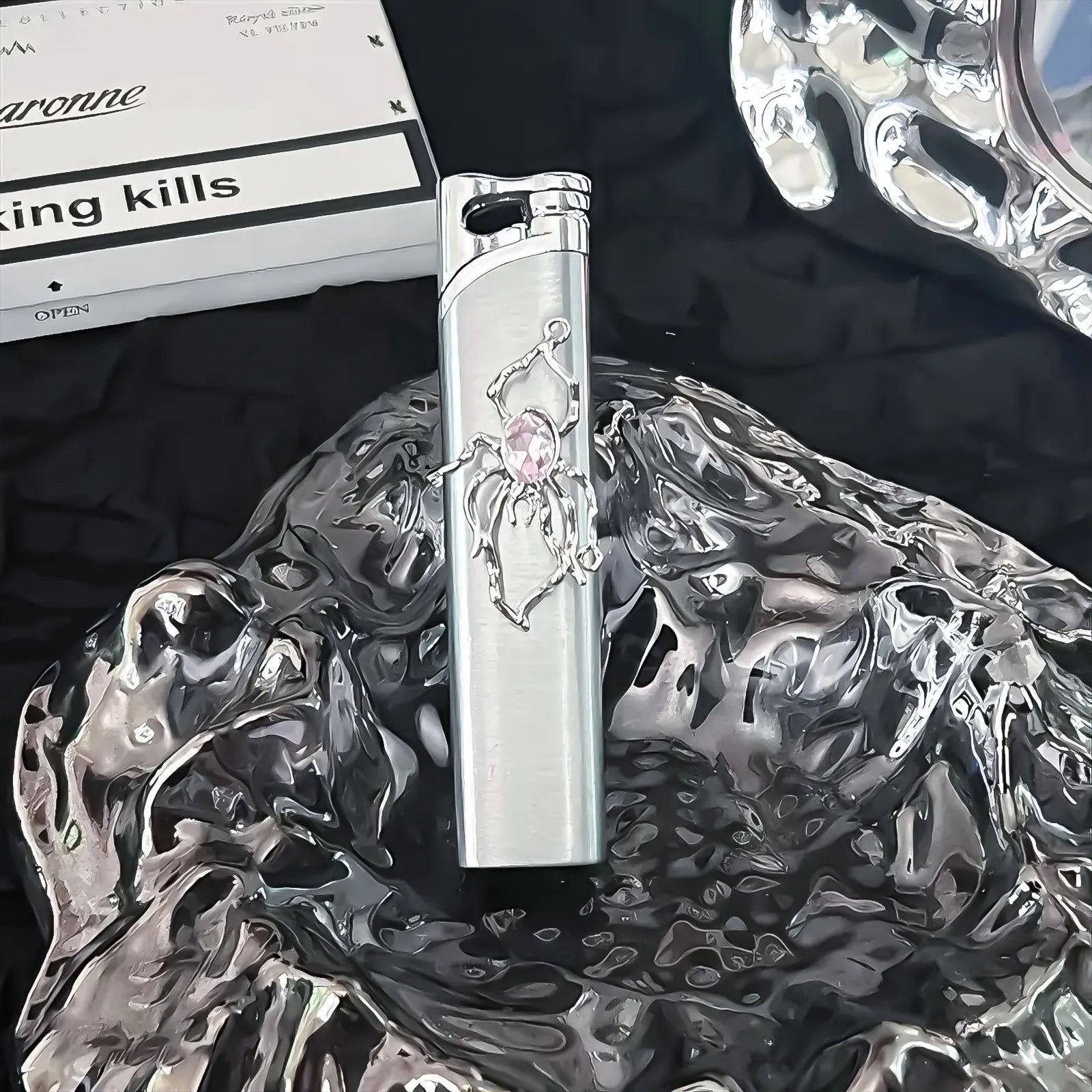 The Rose Arachnid Lighter: metal lighter featuring rose Arachnid Lighter.