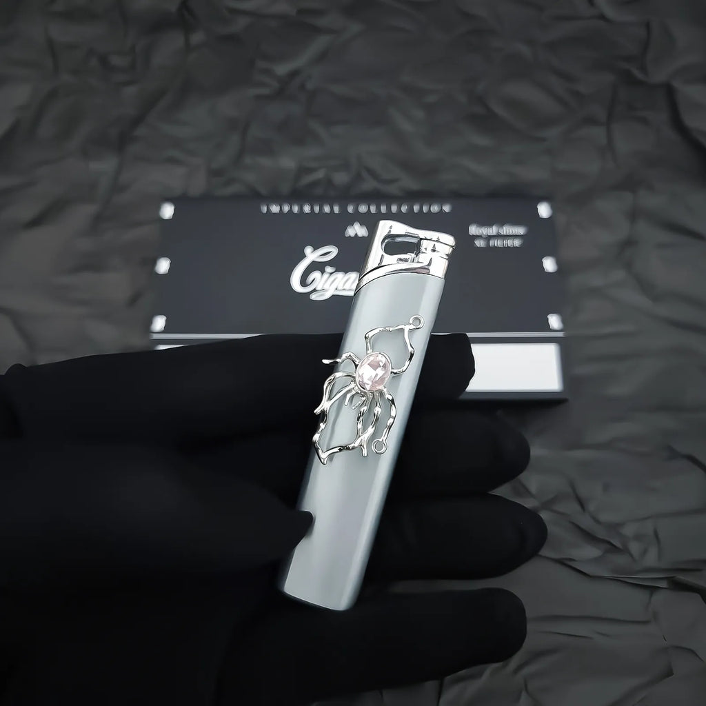 The Rose Arachnid Lighter: metal lighter featuring rose Arachnid Lighter.