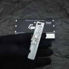 The Rose Arachnid Lighter: metal lighter featuring rose Arachnid Lighter.