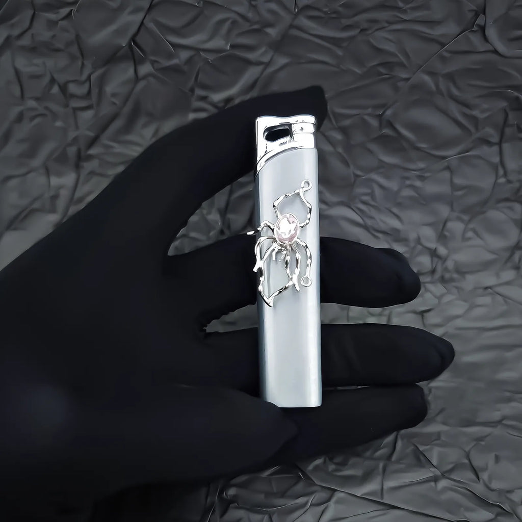 The Rose Arachnid Lighter: metal lighter featuring rose Arachnid Lighter.
